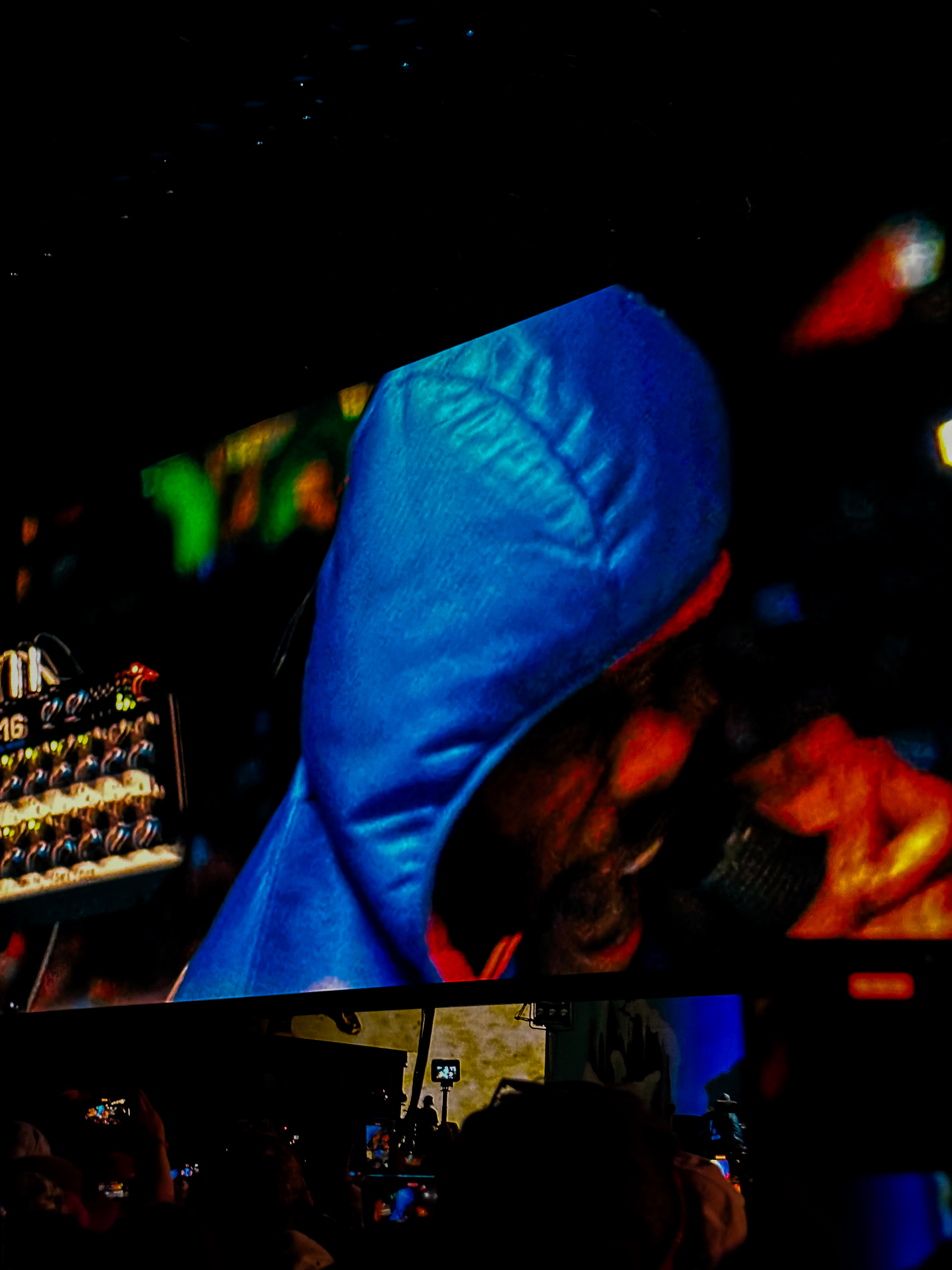 Frank Ocean performance visual, blue hooded figure on screen at Coachella
