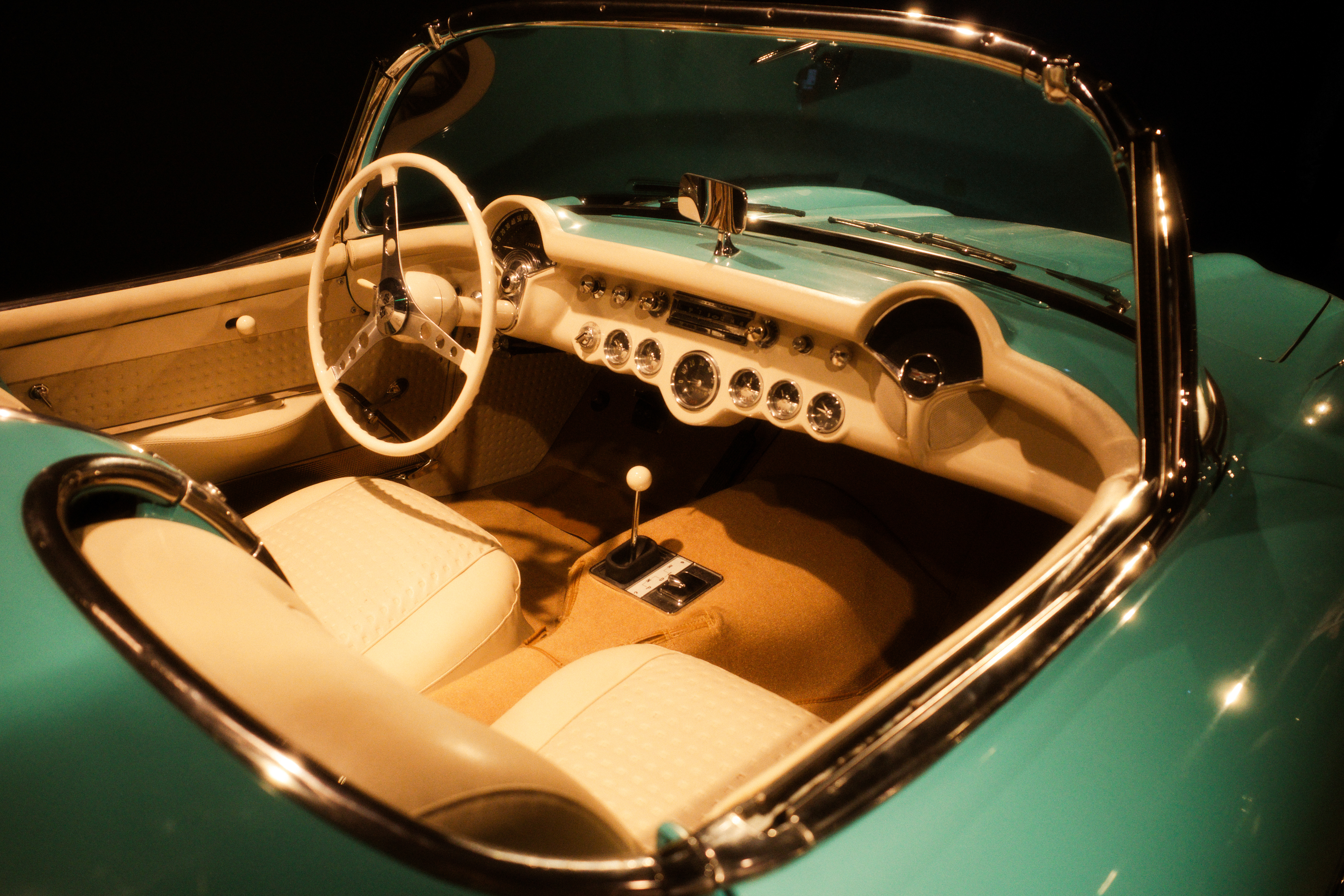 Vintage convertible car interior, teal and cream